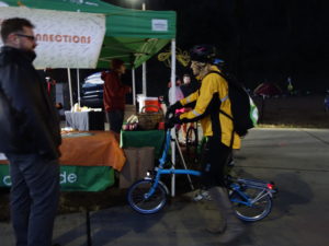People with bikes meeting in early morning at our Bike Everywhere Day Celebration Station table and tent. 
