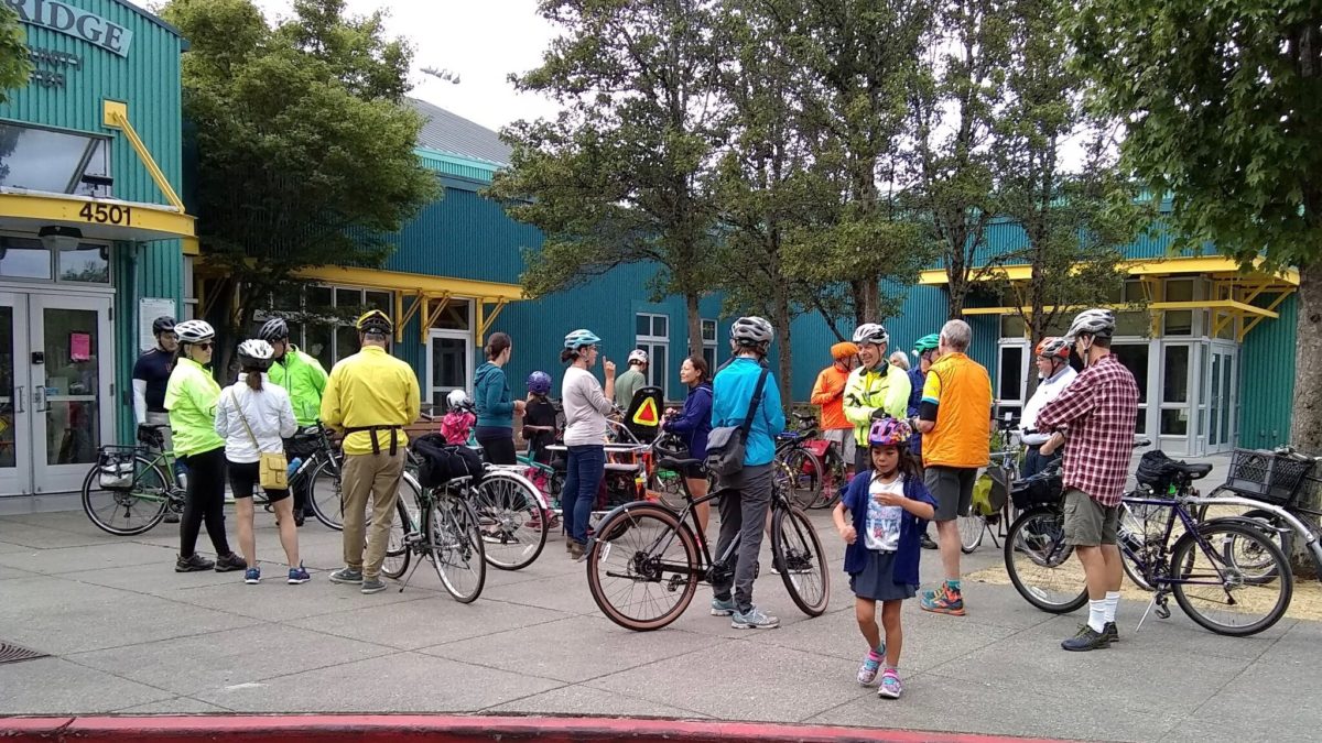 bike riders gathering at Delridge Community Center entry plaza