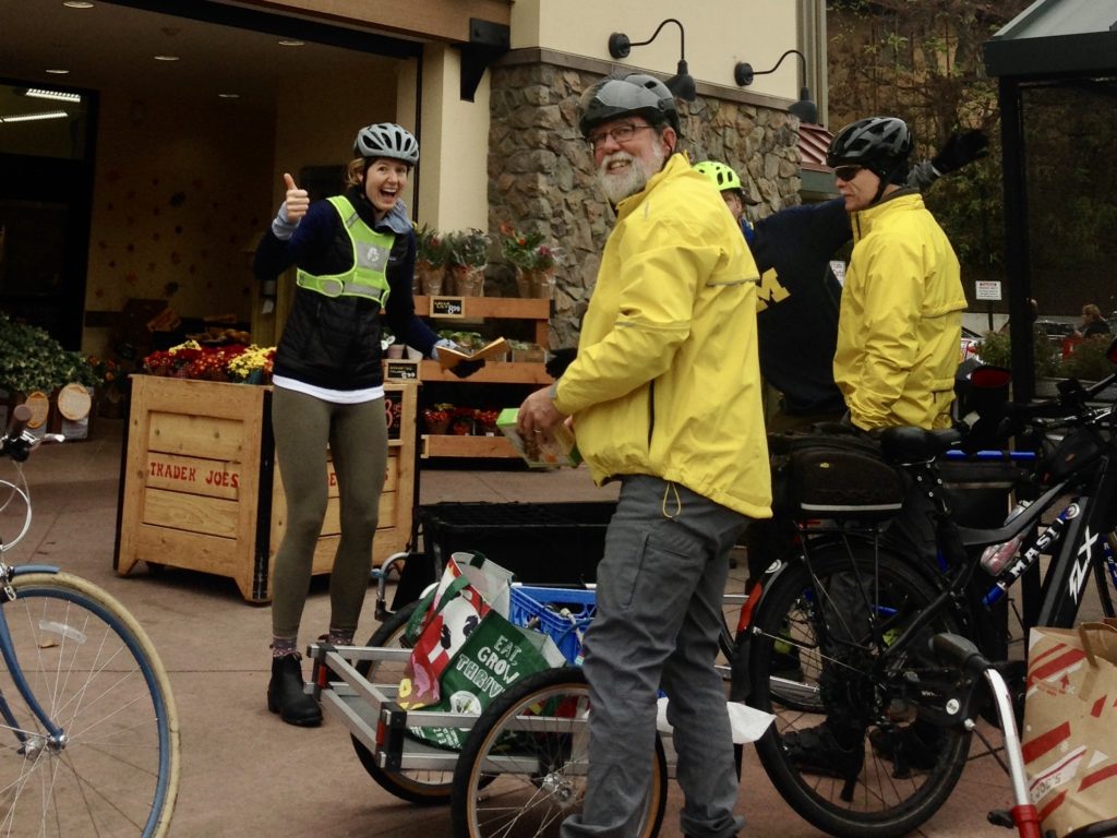 photo of bike rider with trailer loaded with groceries