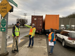 photo on West Marginal Way at Duwamish Trail crossing with SDOT, Port of Seattle and community group representatives talking.