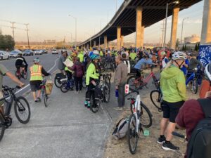 Large group of cyclists gathered at Spokane Street Bridge for memorial for Robb
