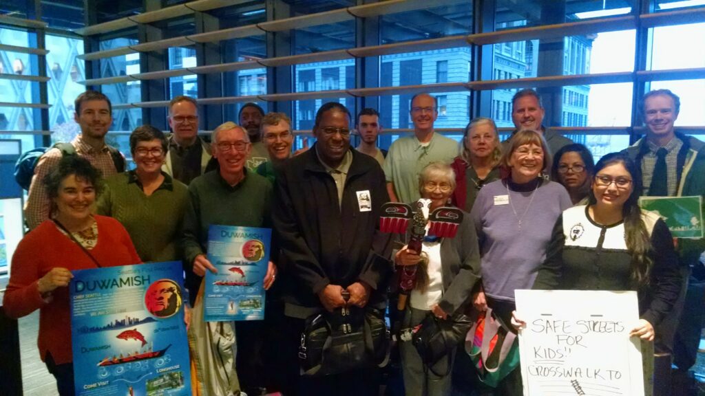 Group photo of people waiting to testify to City Council for safety improvements on West Marginal Way SW at Duwamish Longhouse & Cultural Ceneter