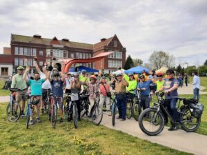 Group photo of bike riders from West Seattle at rally at Jimi Hendrix Park. 